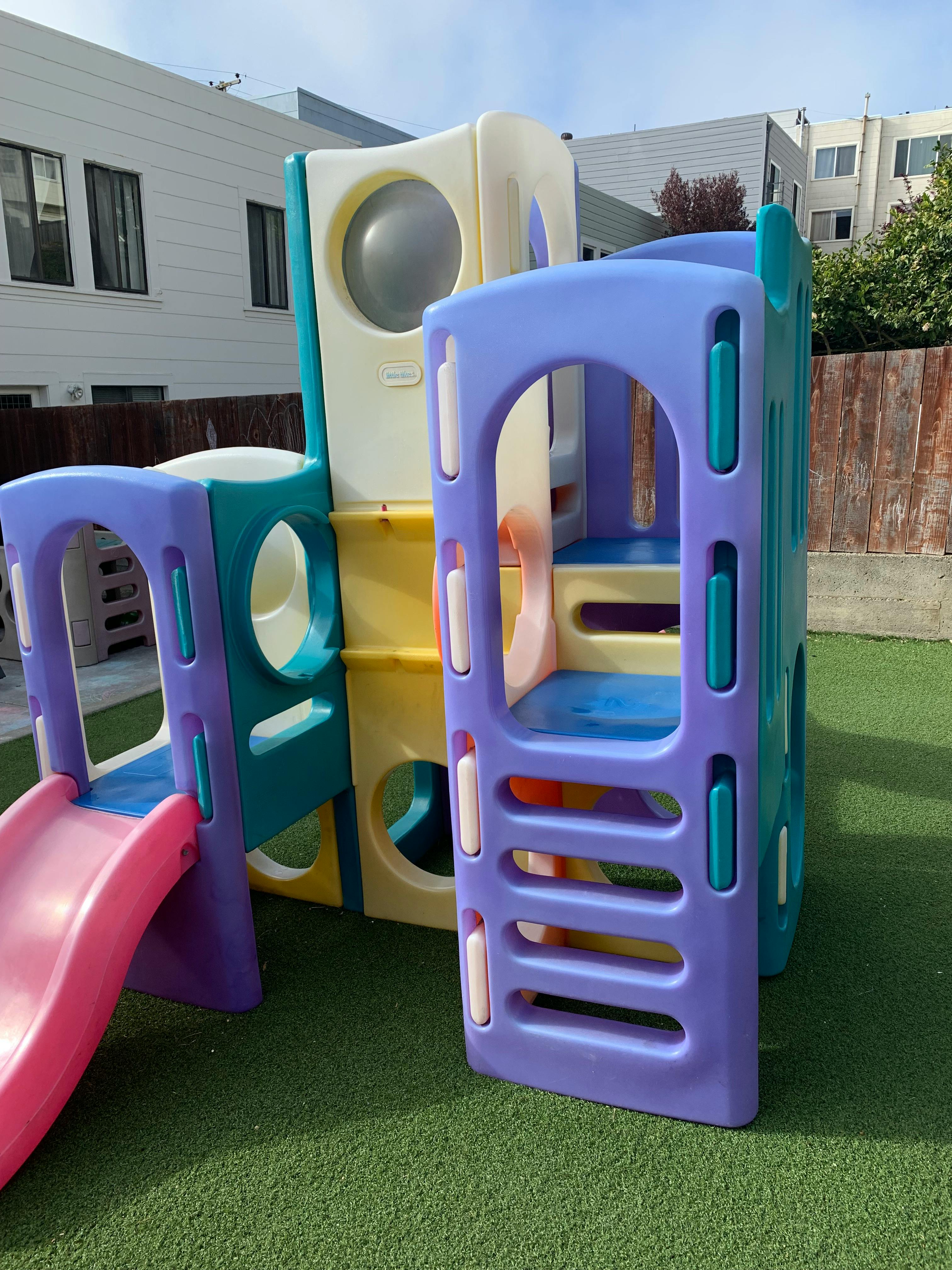 Playground structure with slide and climbing areas