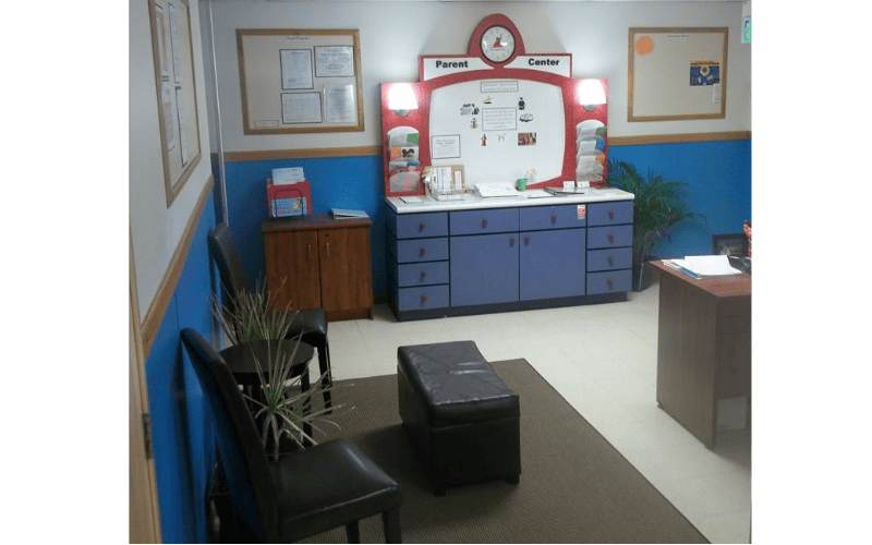 Parent Center information desk in a room with blue walls and a rug