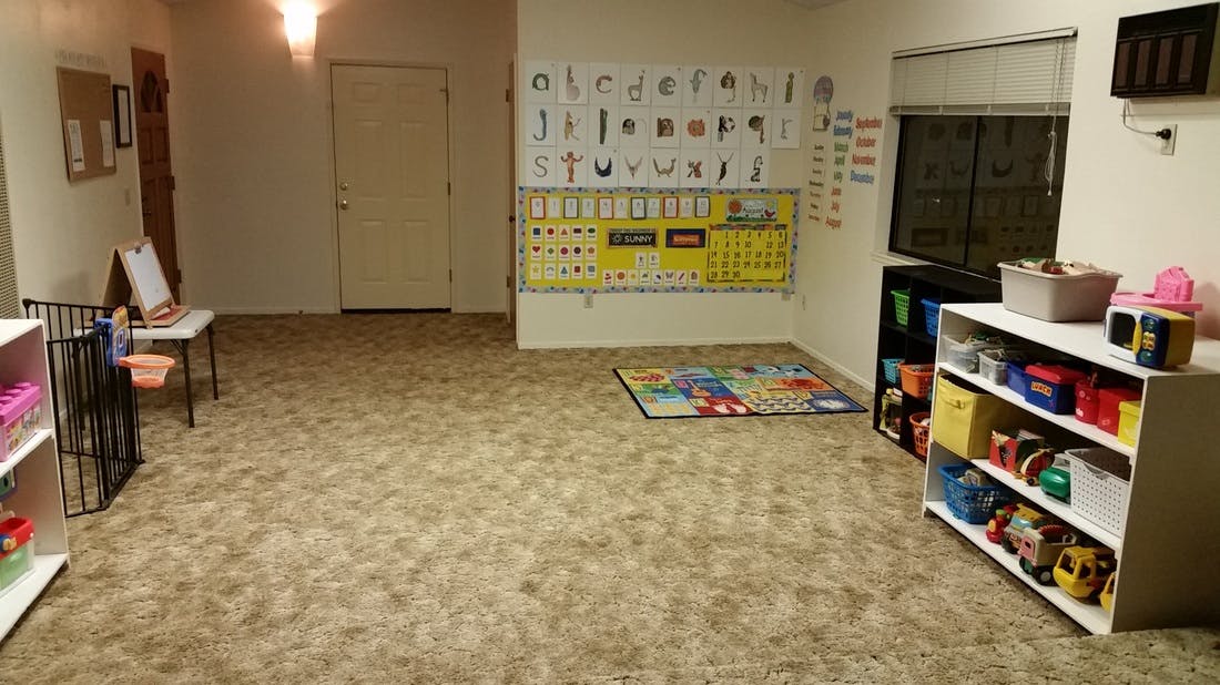 Empty classroom with alphabet chart and toy shelves