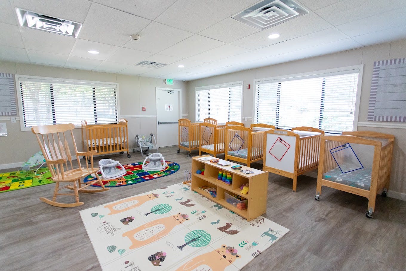 Cribs and child care equipment in a daycare room