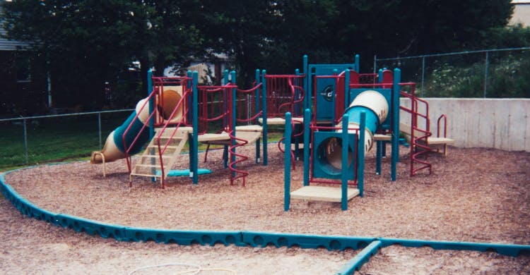 Playground structure with slides and climbing areas
