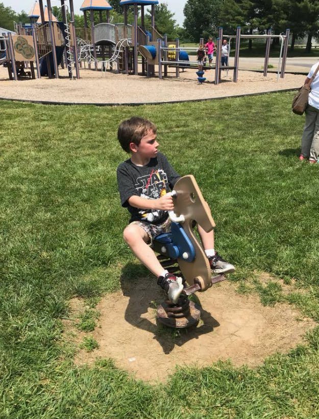 Child on a spring rider at a playground