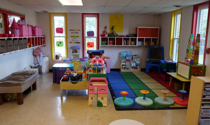 Playroom with colorful toys, tables, and chairs
