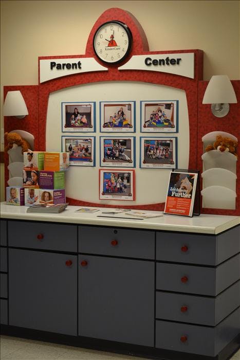 Parent Center display with a clock, photos of children, and information leaflets