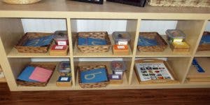 Shelves with baskets containing learning materials