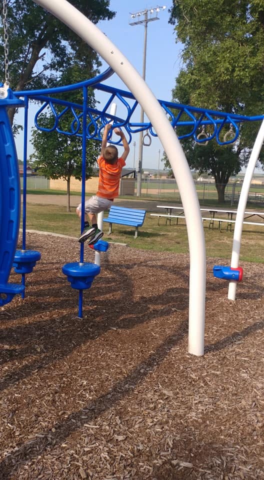 Child on playground equipment