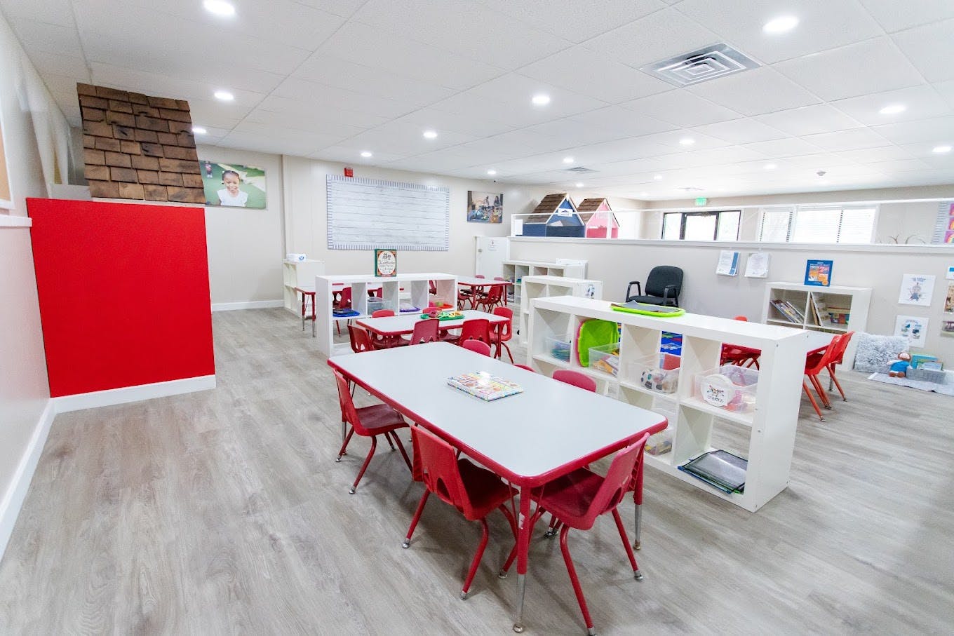 Tables and small chairs arranged in a preschool classroom