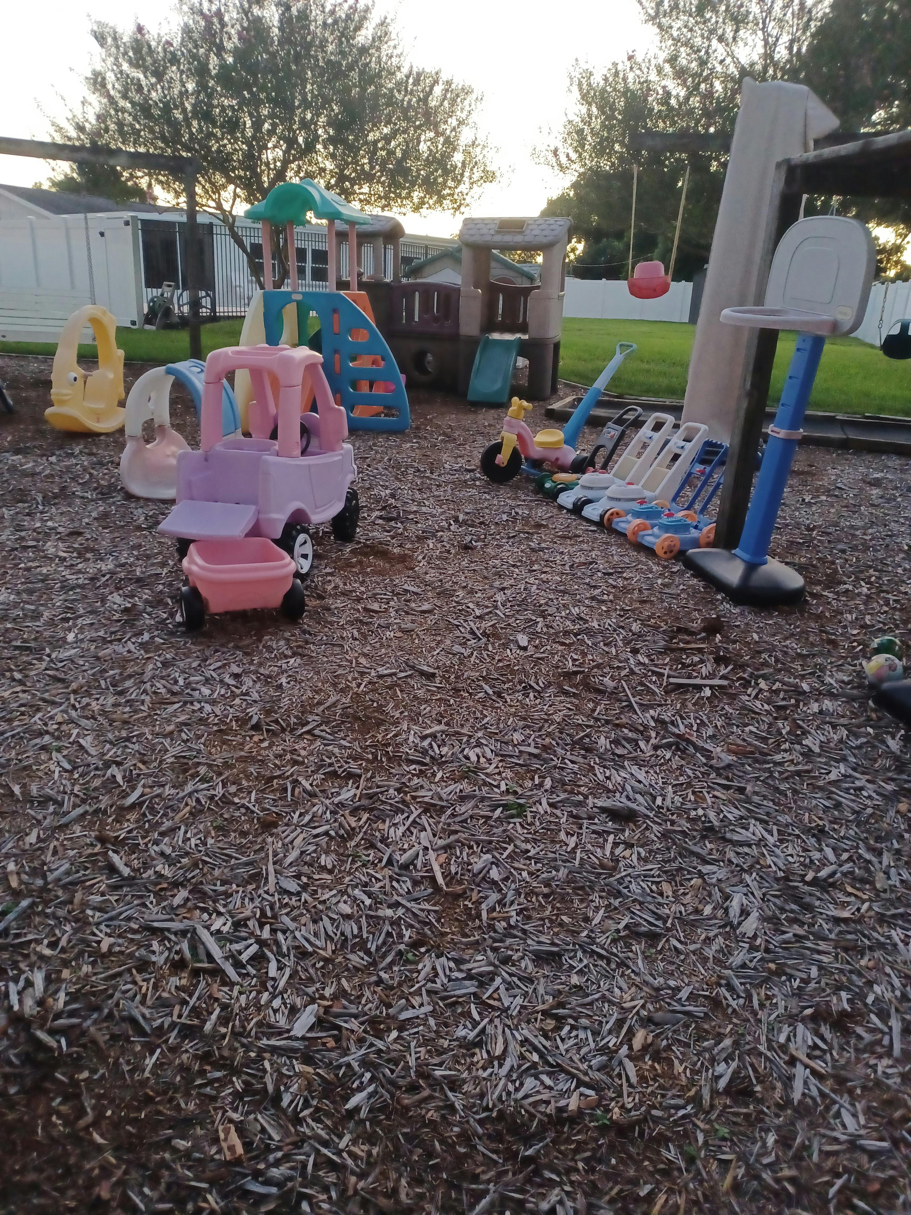 Playground with various toys and play structures on wood chips
