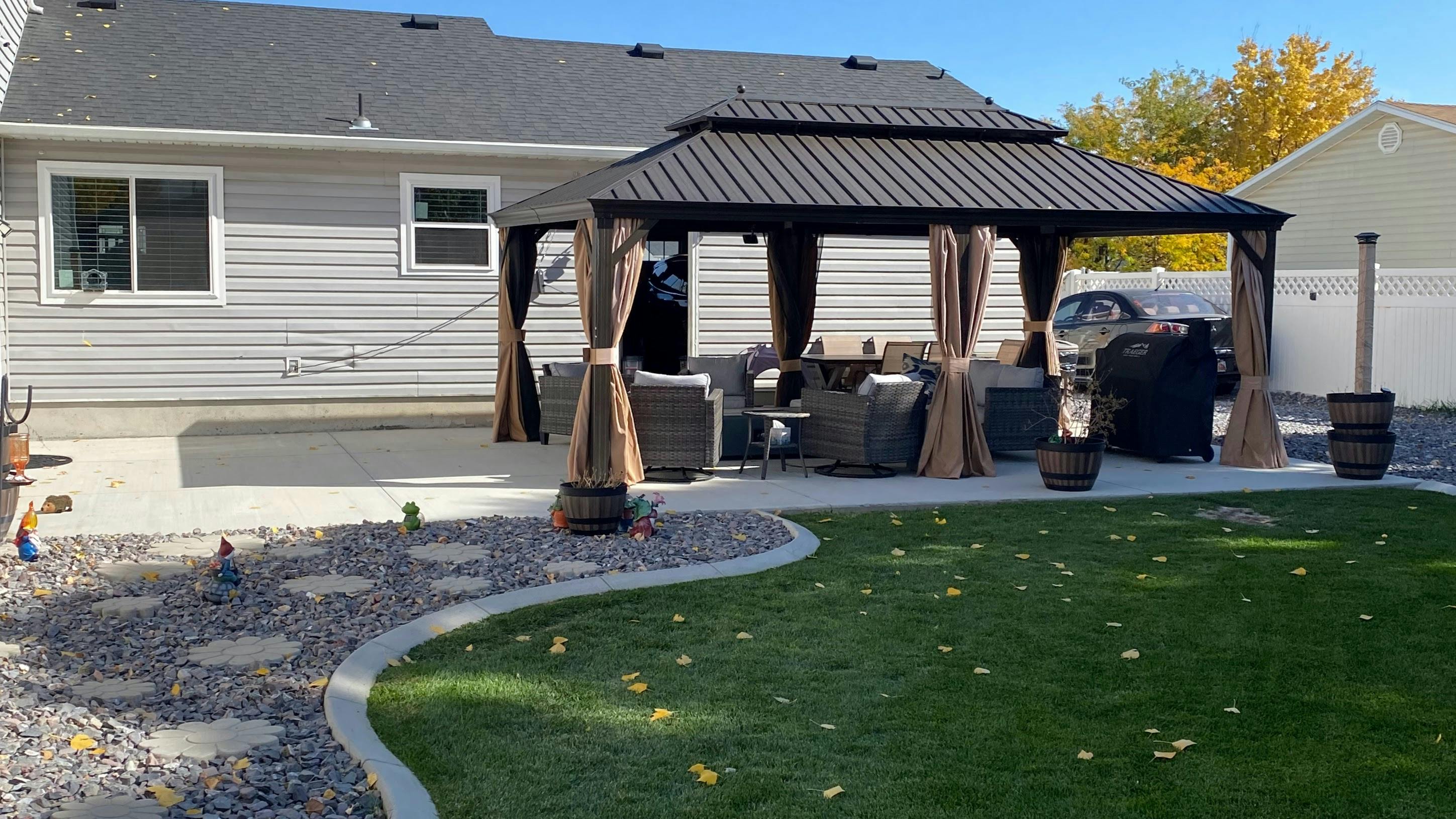 Backyard patio with a gazebo and outdoor furniture