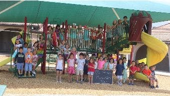 Children on and around a playground structure