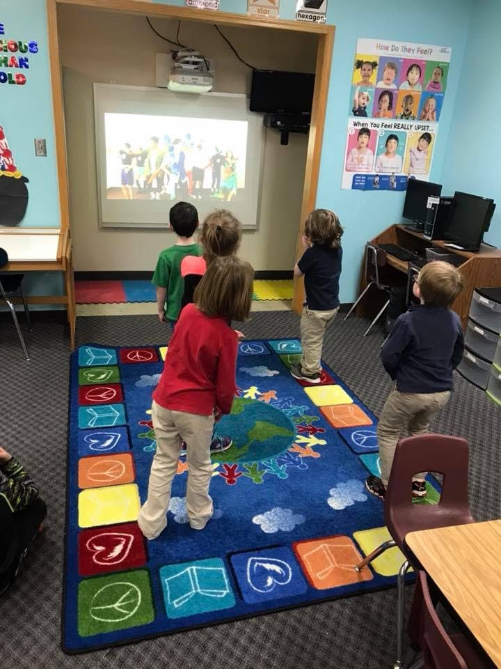 Children watching a projected image in a classroom