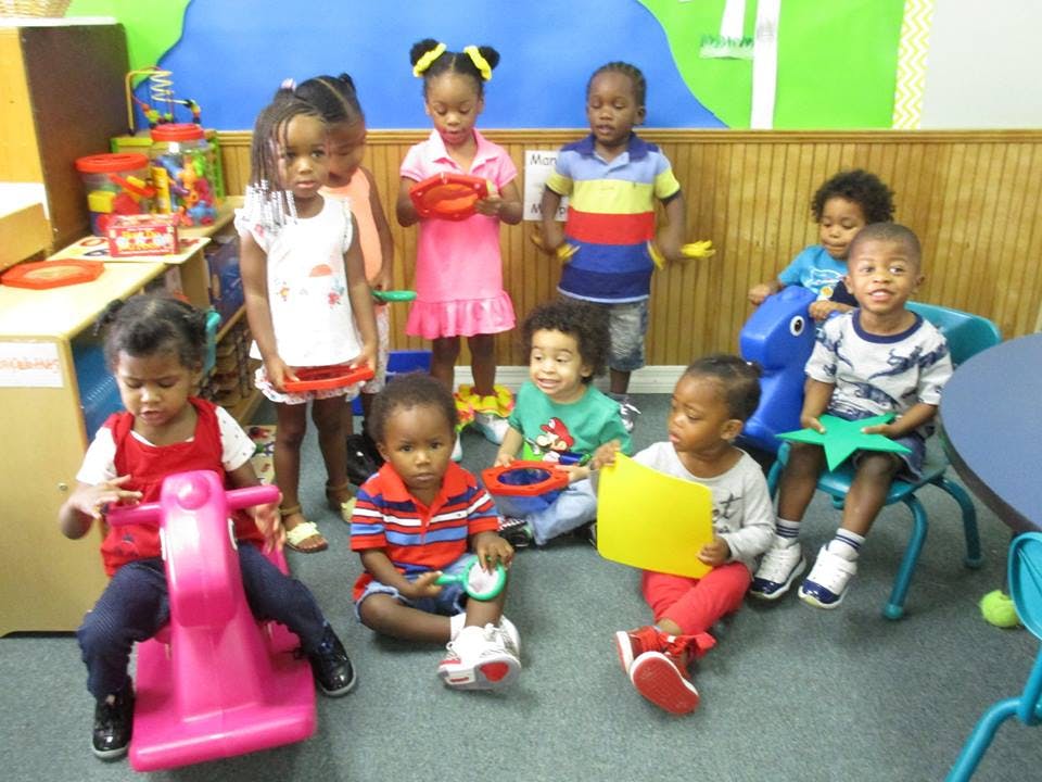 Group of children playing with toys in a classroom