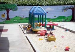 Play structure in a sandbox