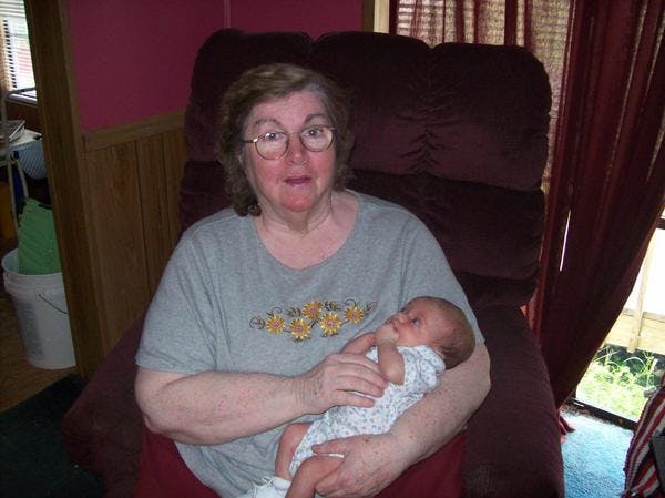 Person holding a sleeping infant
