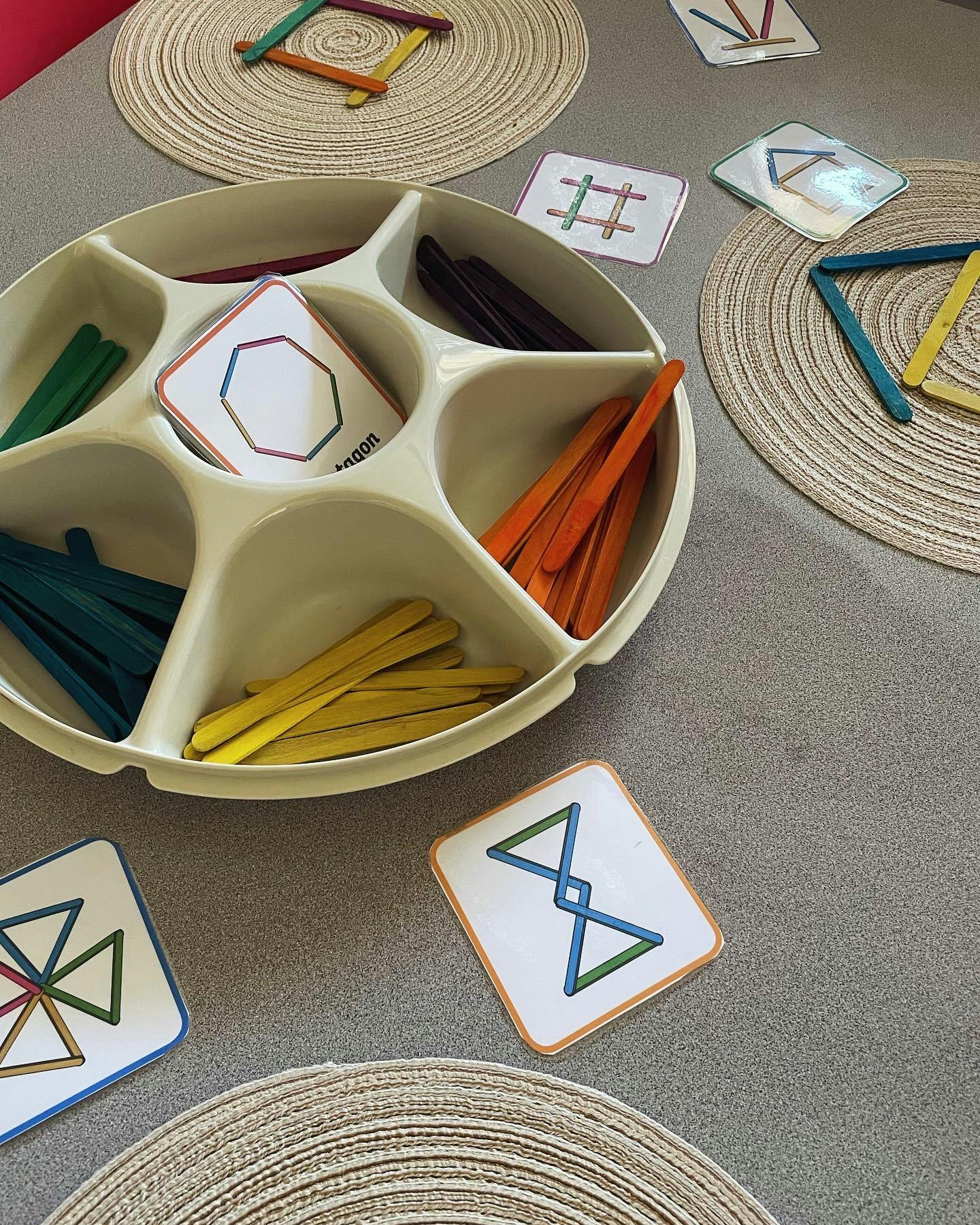 Craft sticks and pattern cards on a table