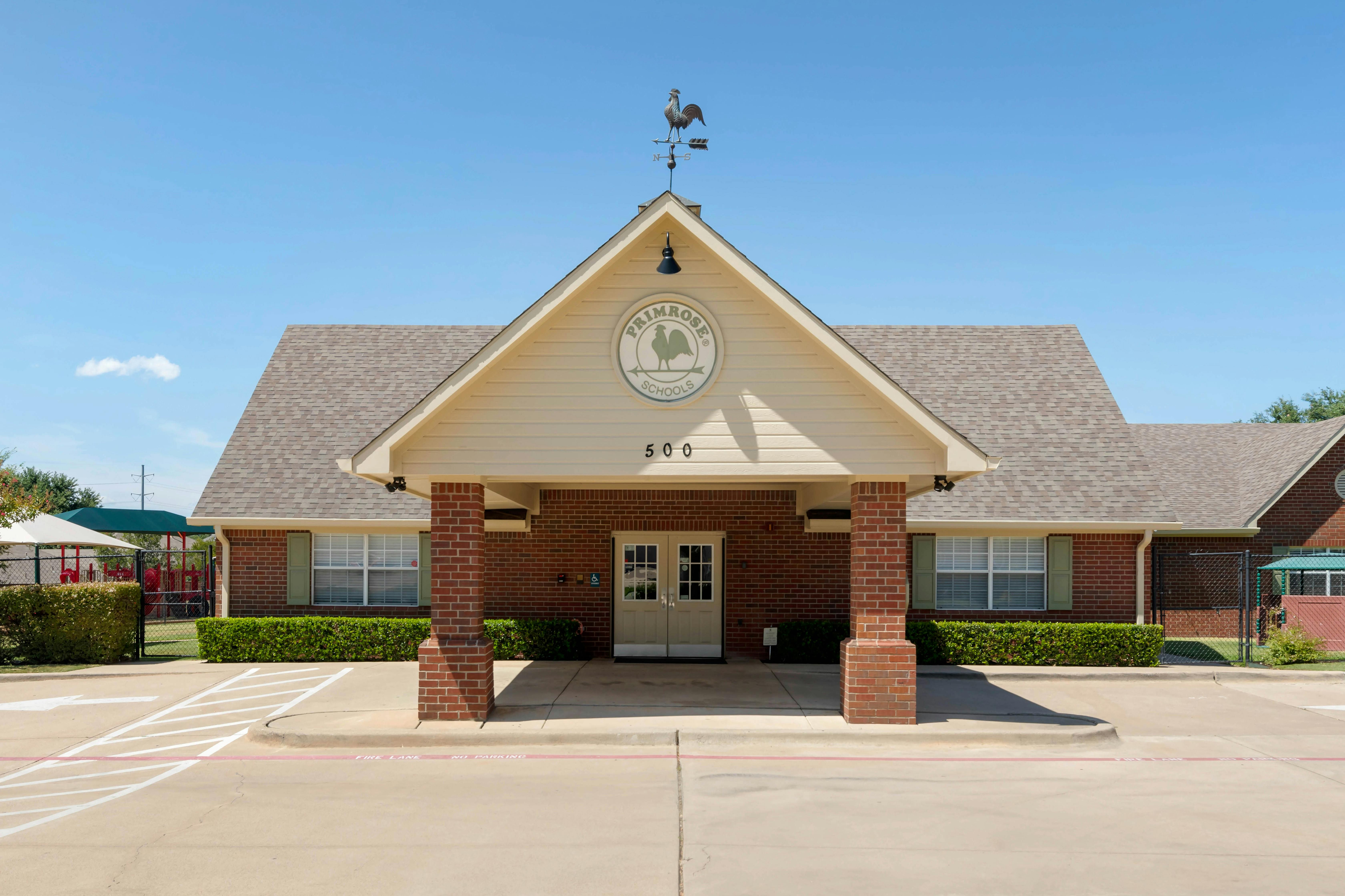 Primrose Schools building with "500" address and rooster weathervane