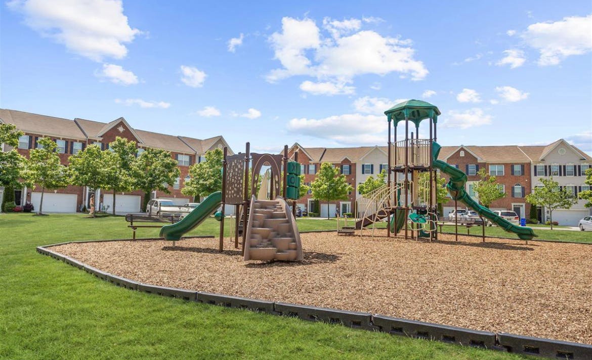 Playground with slides and climbing structures on wood chips
