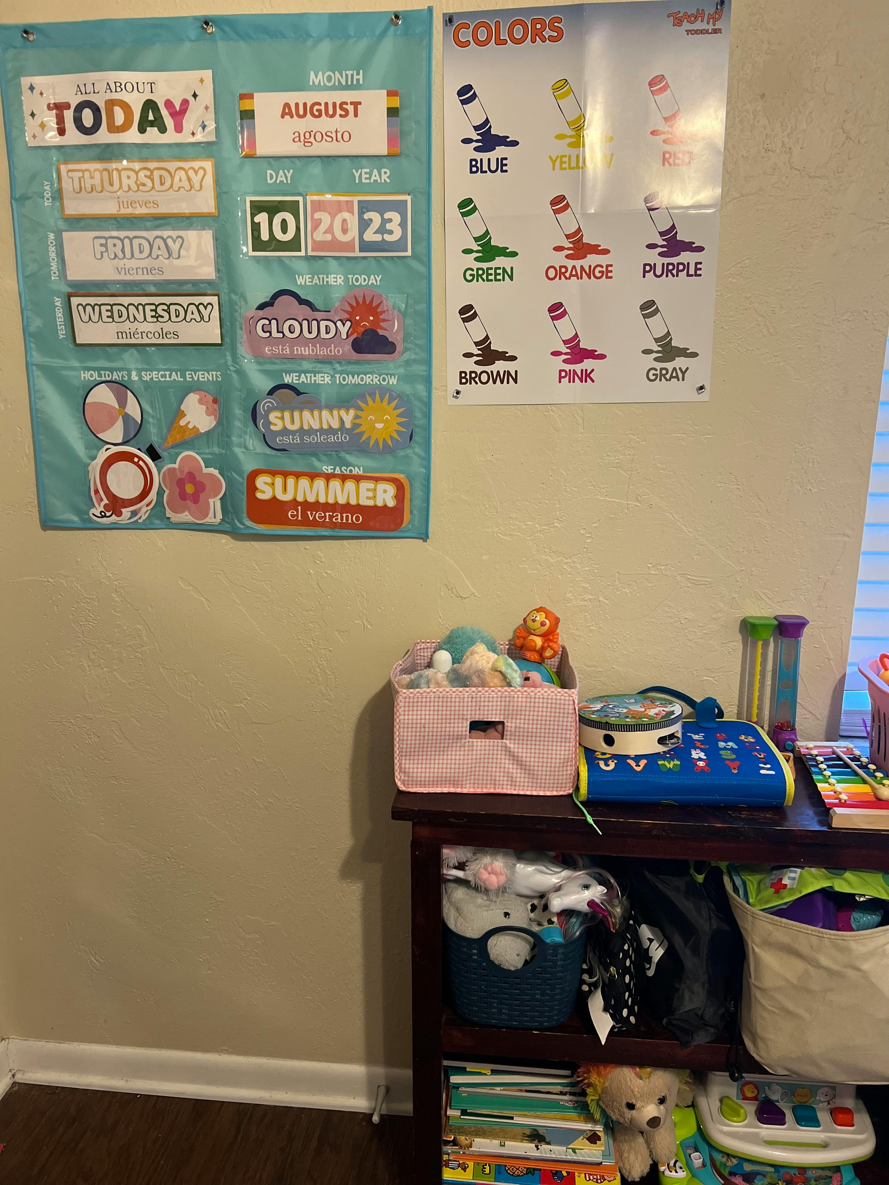 Wall calendar with days, months, and weather, next to a colors chart