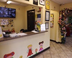 Reception desk with a person behind it