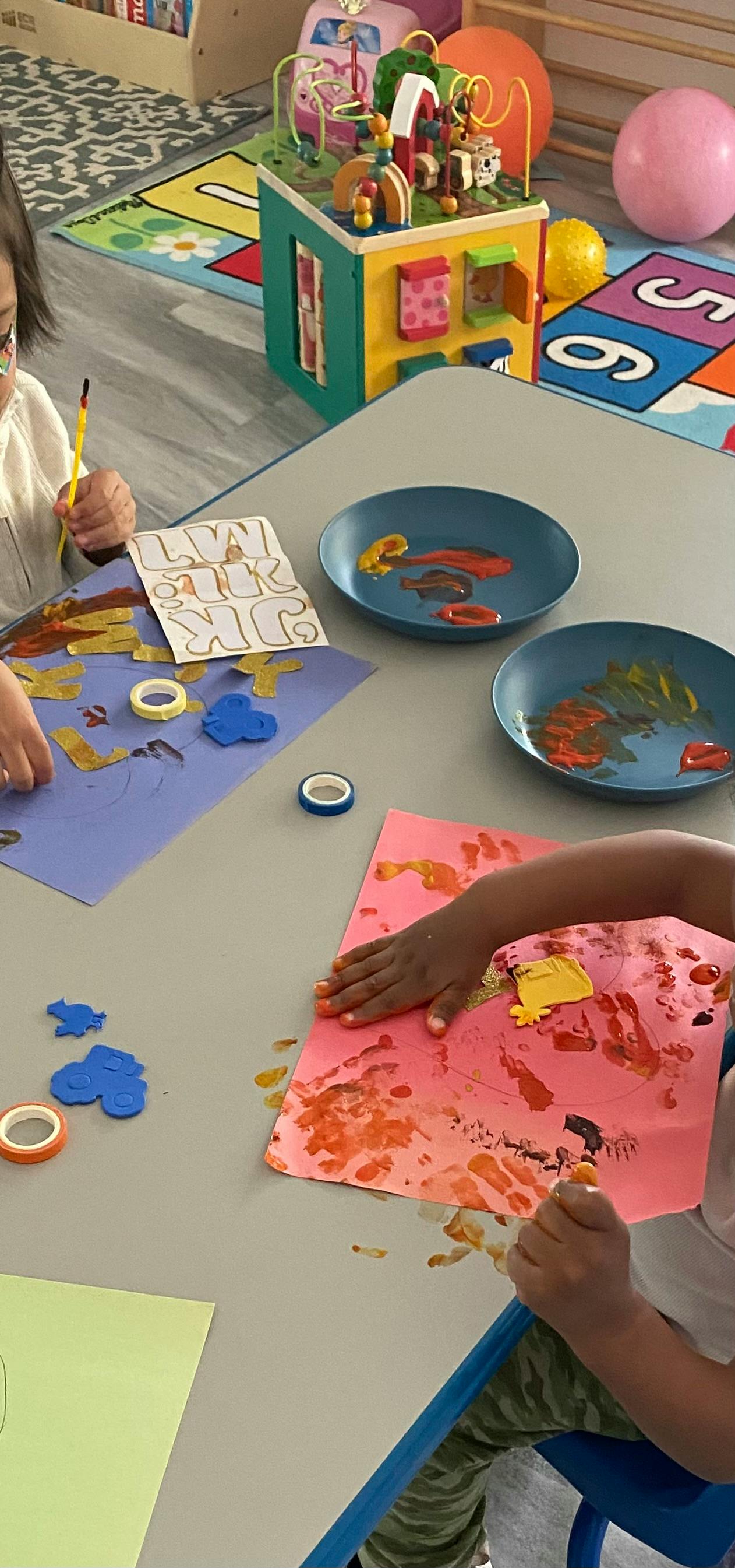 Children doing arts and crafts at a table