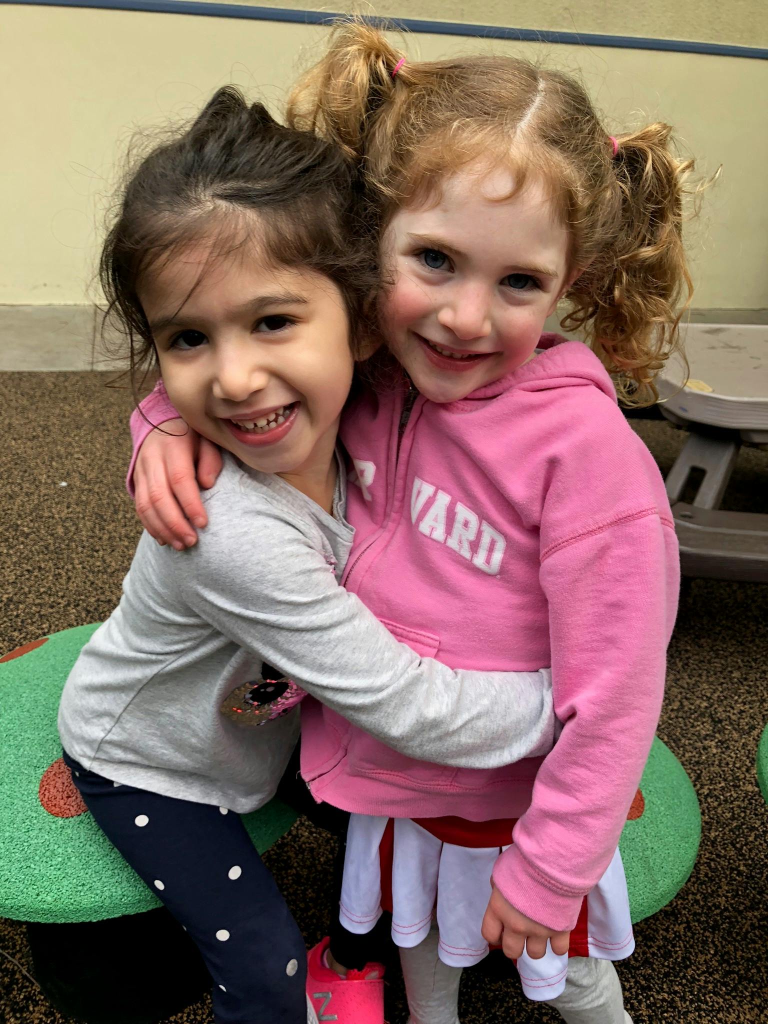 Two children hugging
