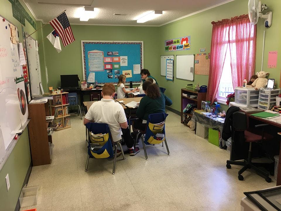 People sitting at desks in a classroom