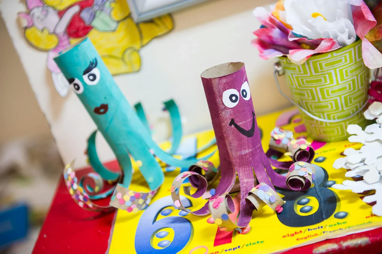 Two craft octopuses made from toilet paper rolls