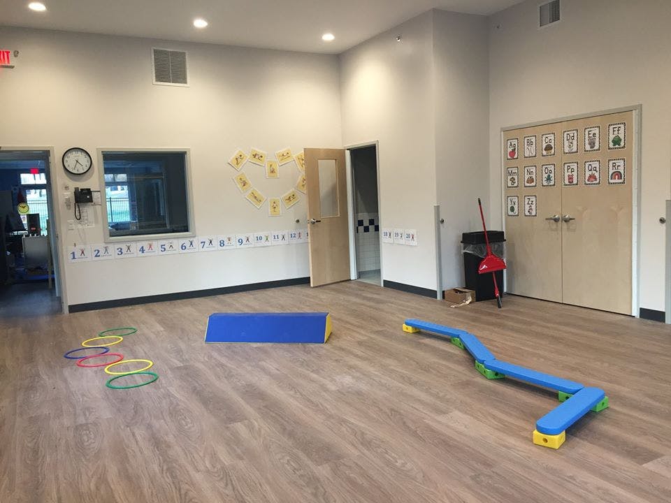 Empty classroom with play equipment on the floor