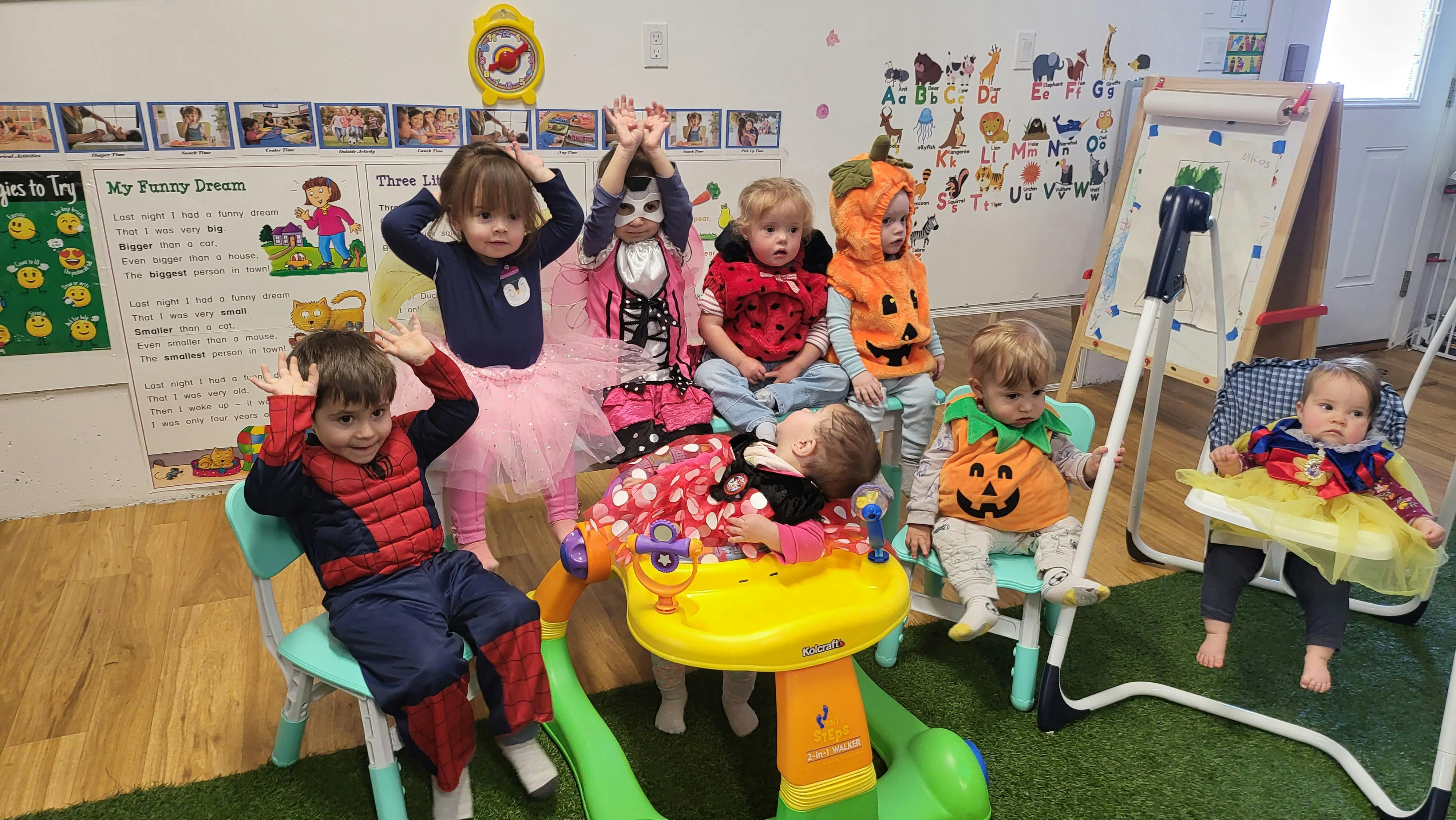 Group of children in costumes in a classroom