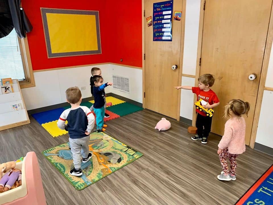 Children playing in a classroom