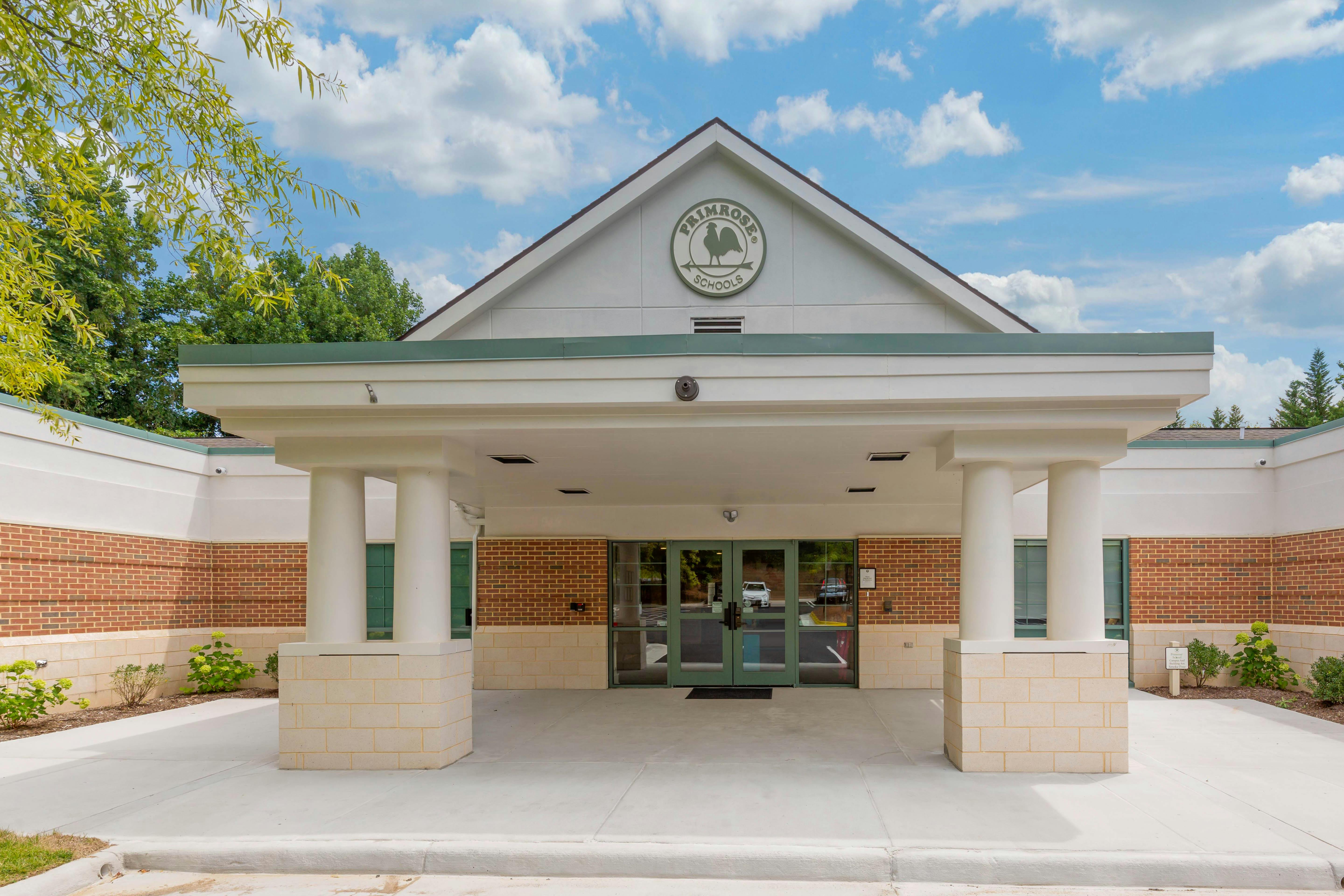 Entrance to Primrose Schools building with columns and brick walls