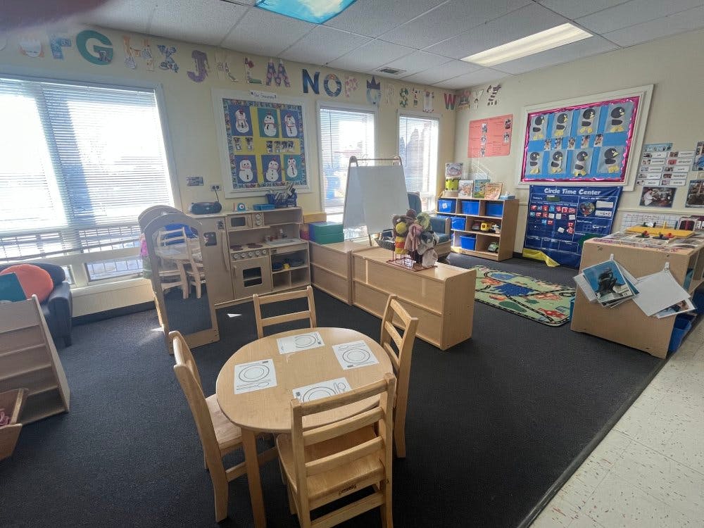 Classroom with child-sized furniture and colorful decorations