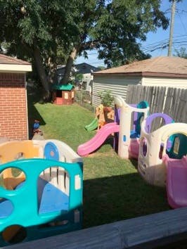 Playground with multiple slides and playhouses