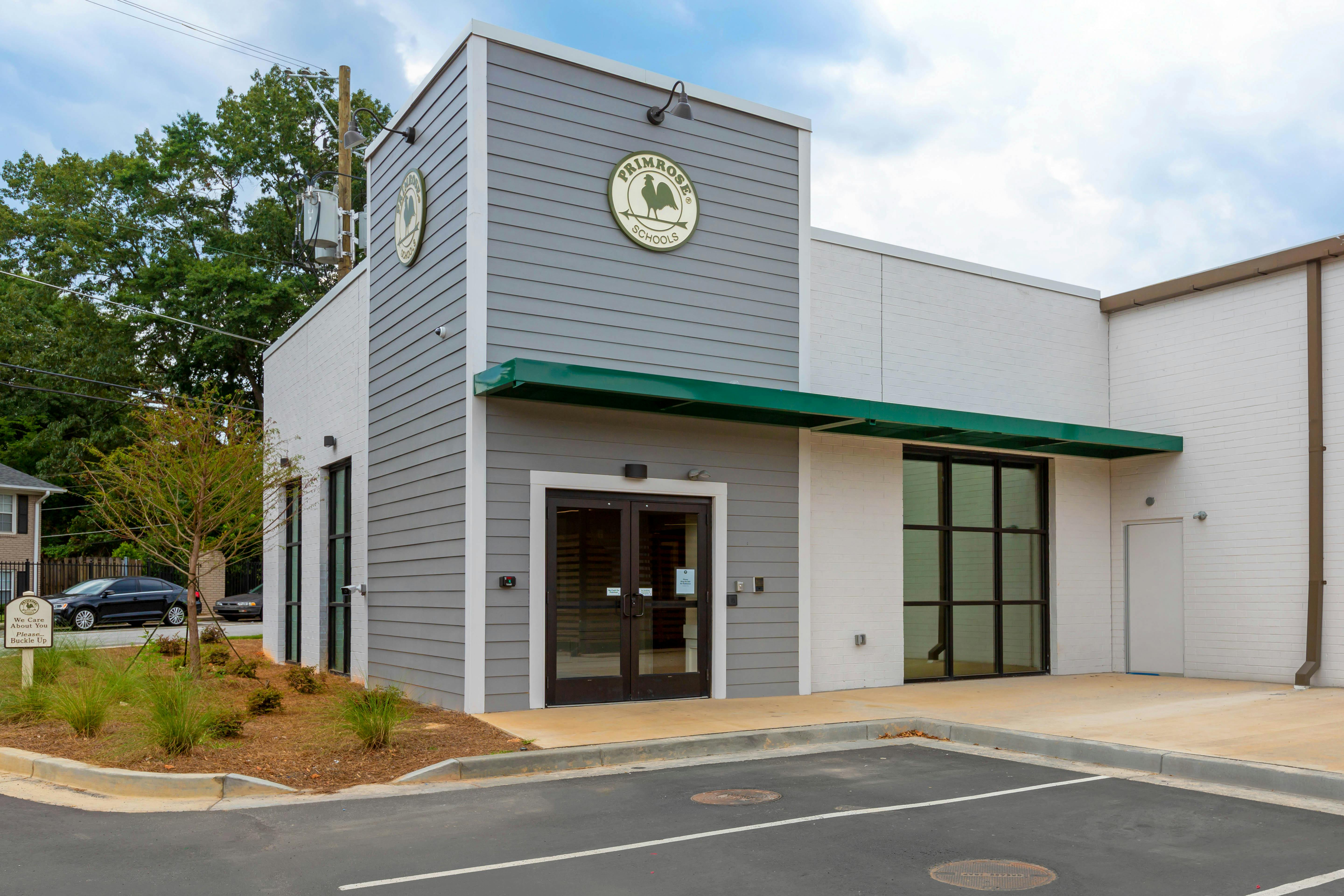 Exterior view of a Primrose Schools building with a green awning