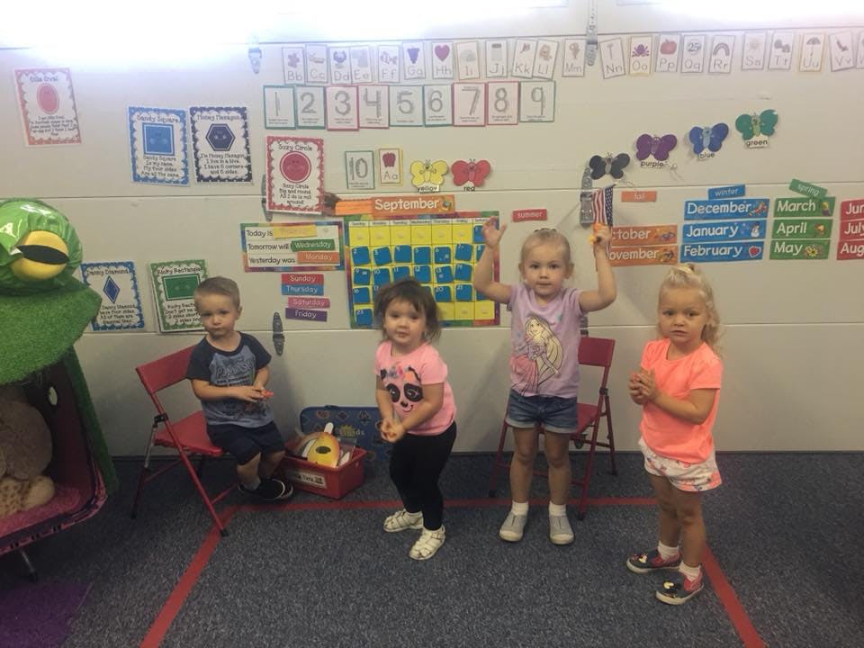 Four children in a classroom