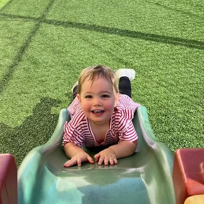 Child on a slide on a playground