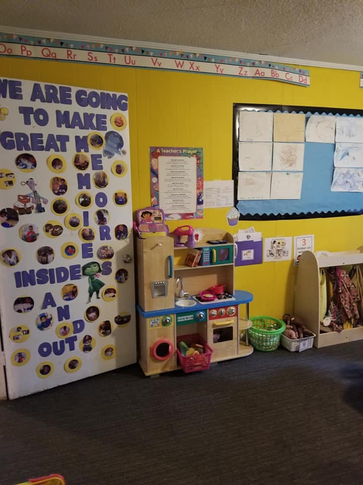Play kitchen and bulletin board in a classroom