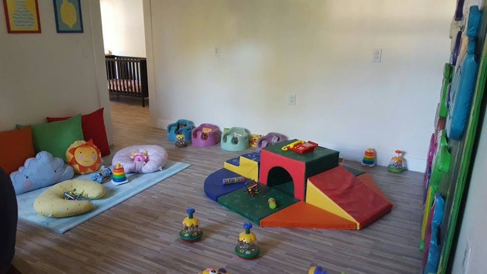 Playroom with soft play equipment and cushions