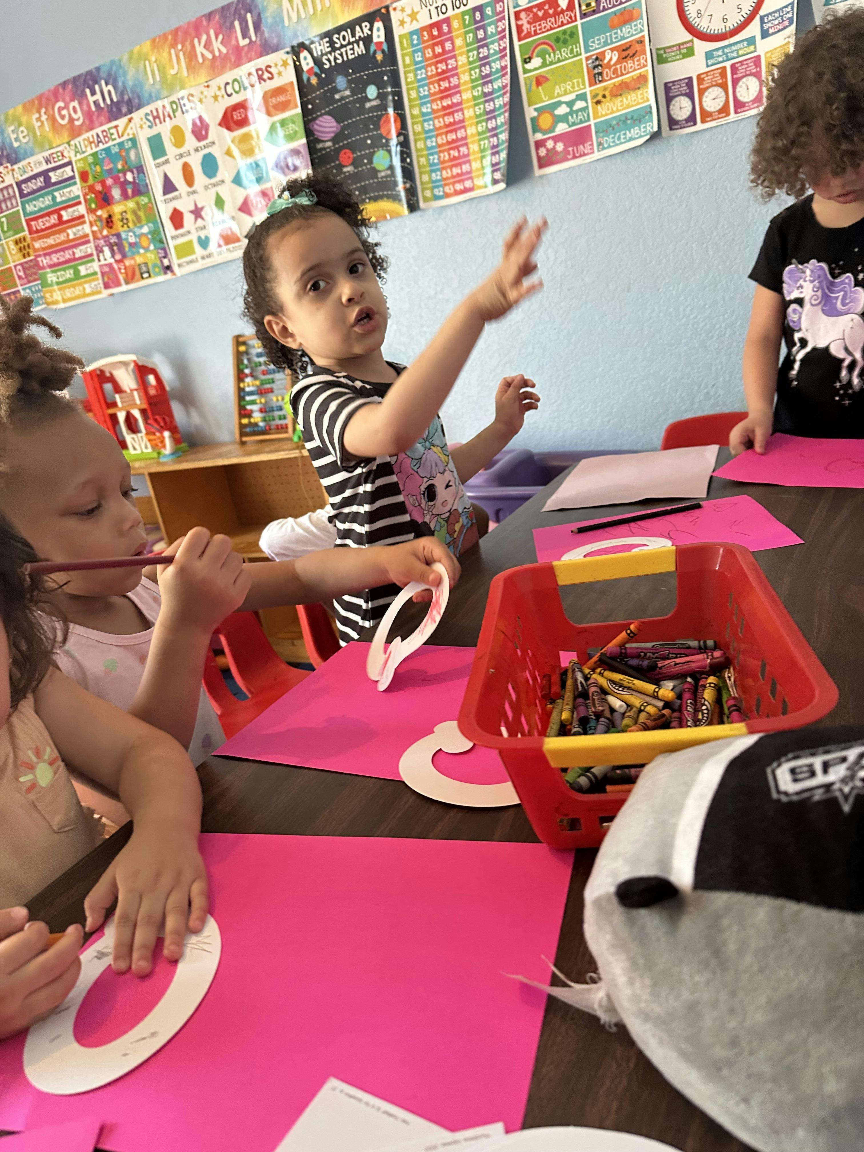 Children at a table with art supplies