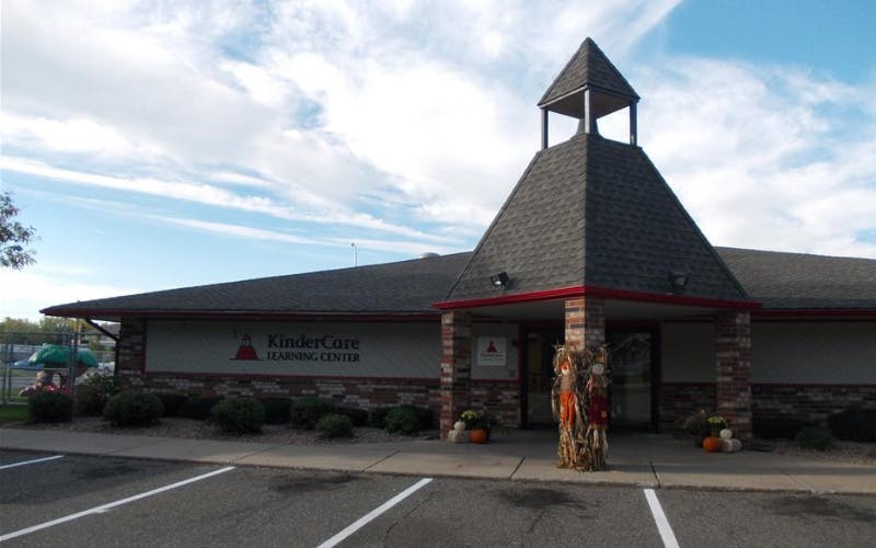 KinderCare Learning Center building exterior with a small steeple and brick facade