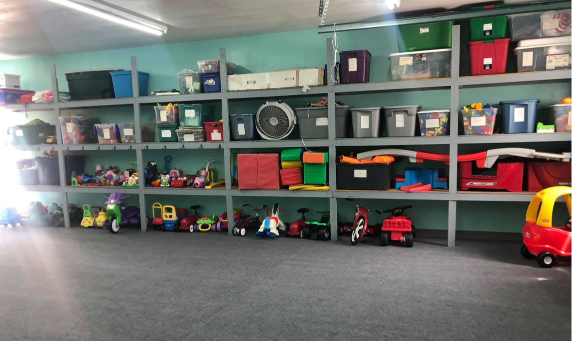 Shelves filled with toys and storage bins