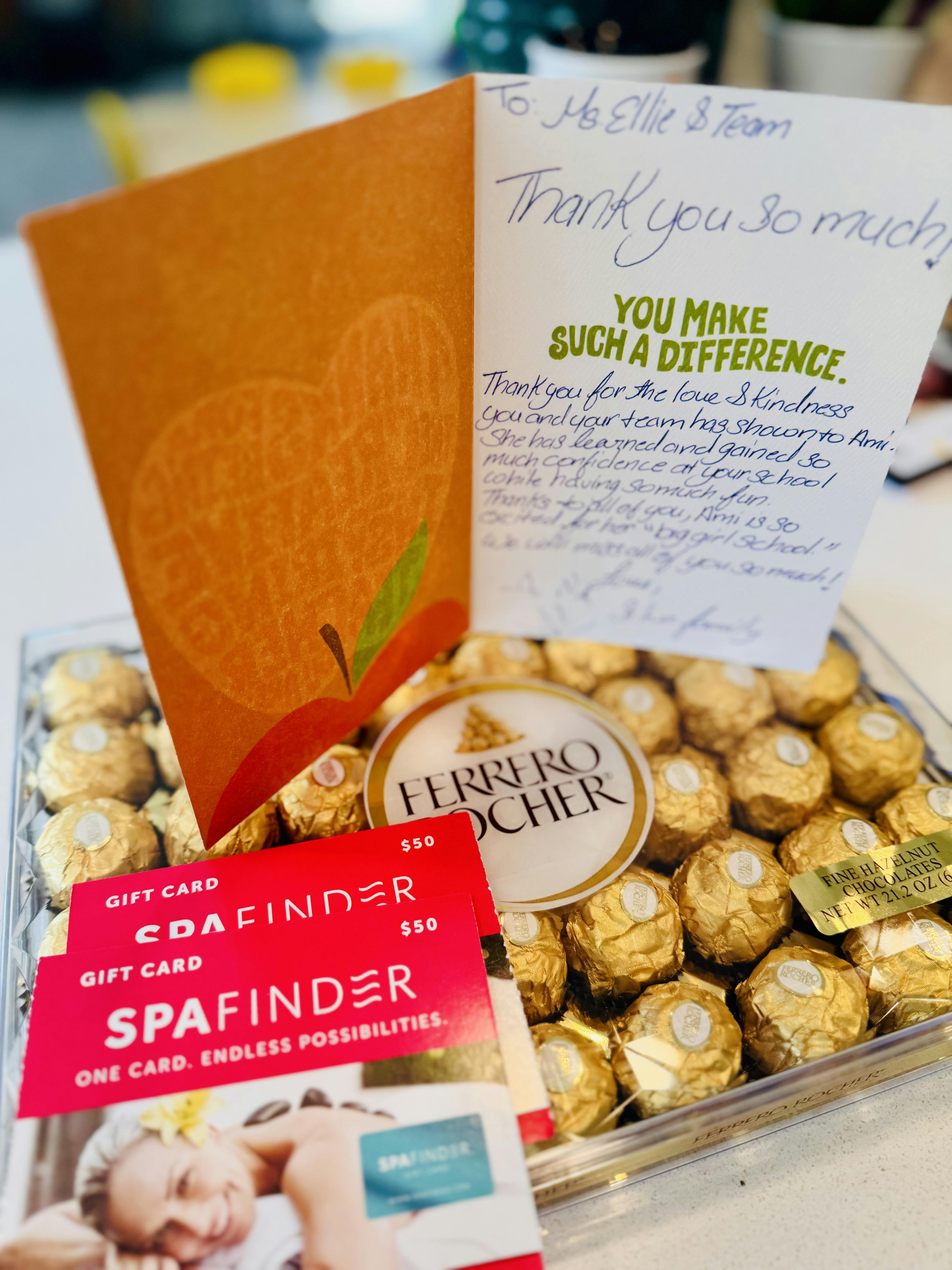 Thank you card, Ferrero Rocher chocolates, and Spafinder gift cards