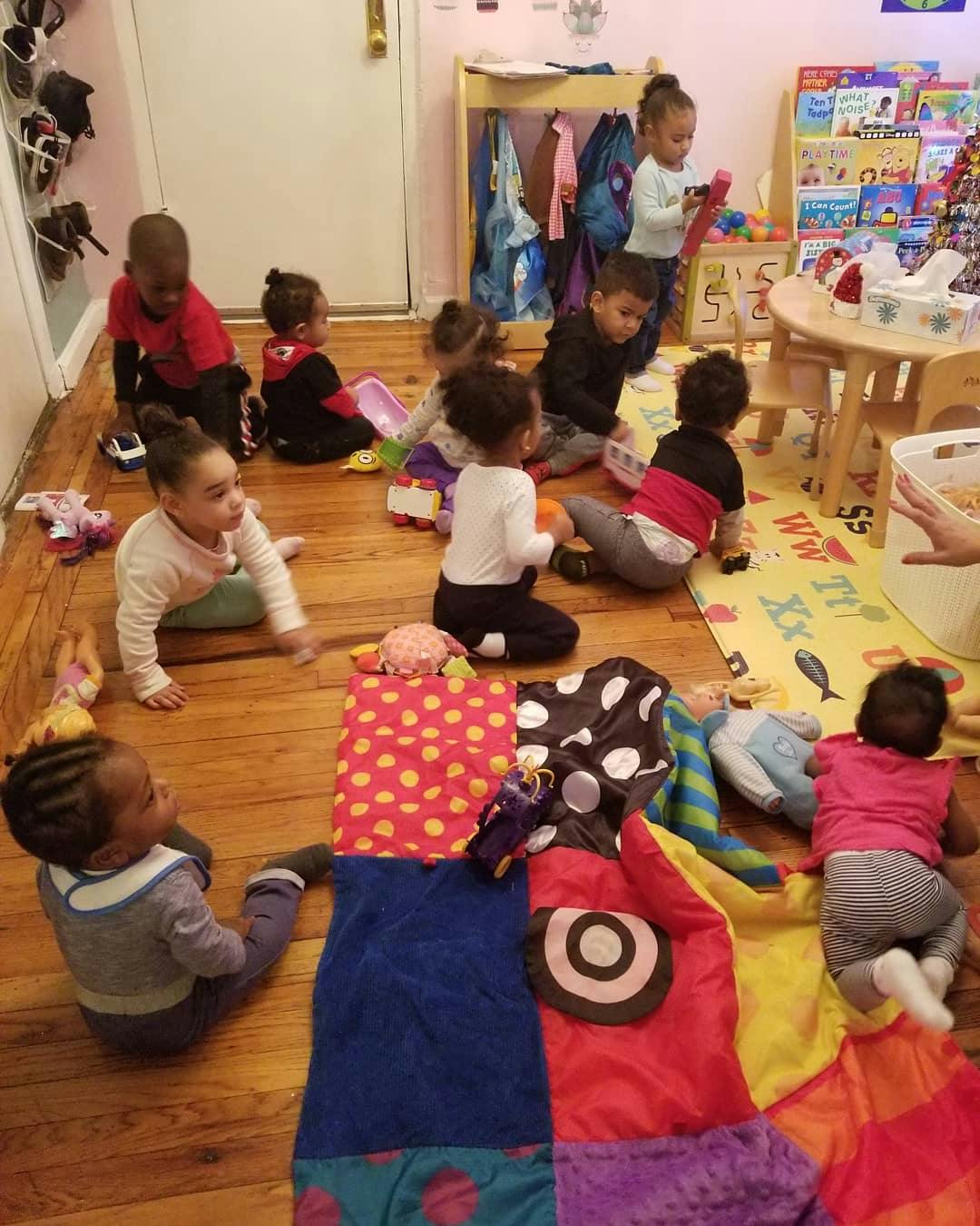 Group of children playing on the floor in a room