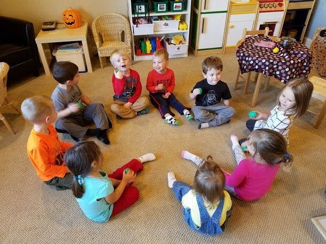 Children sitting in a circle on the floor