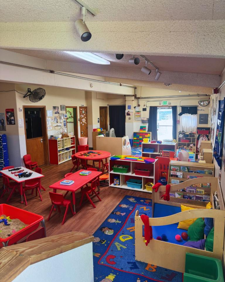 Classroom interior with small tables and chairs for children