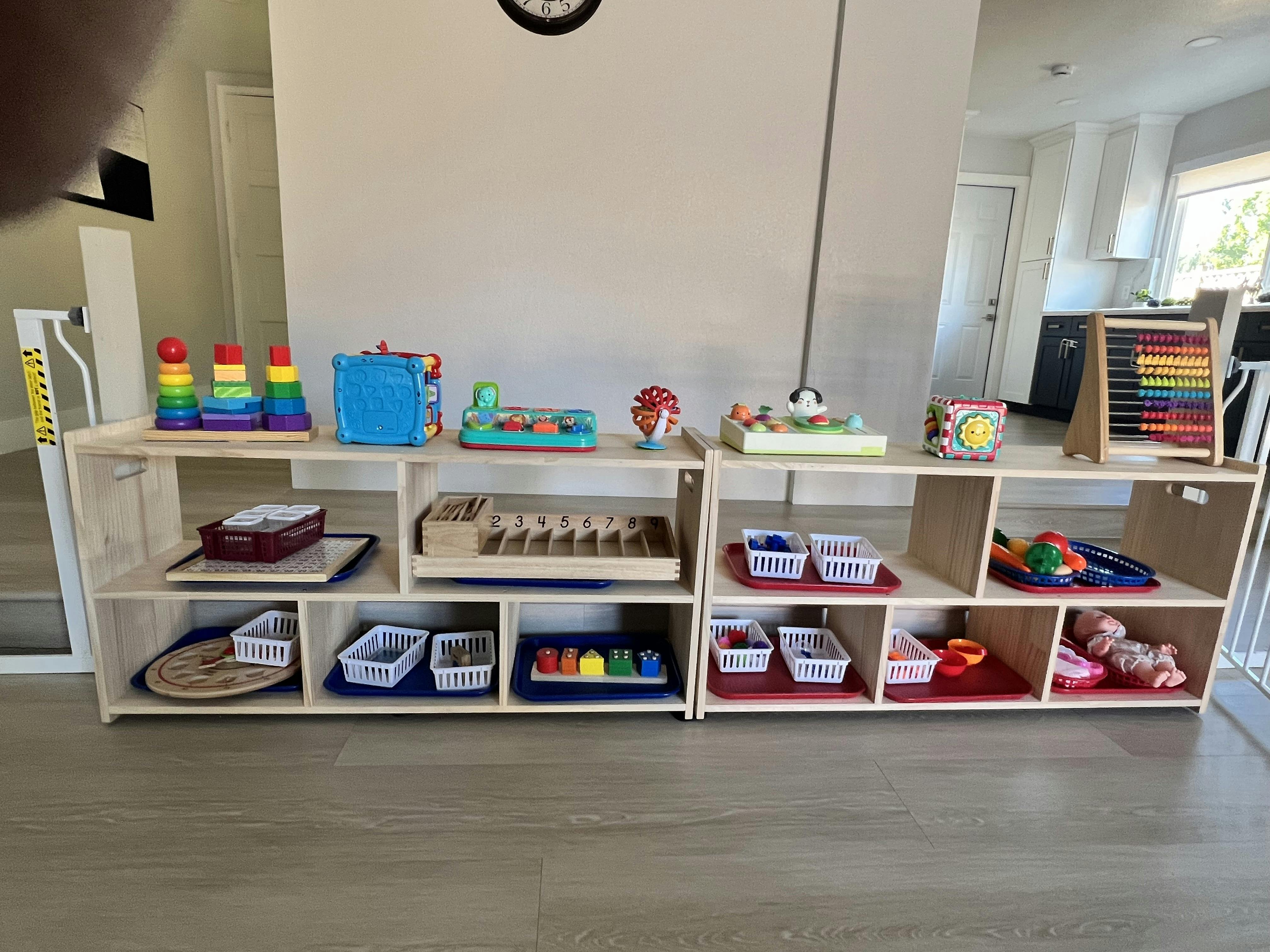 Wooden shelves organized with various children toys and educational materials