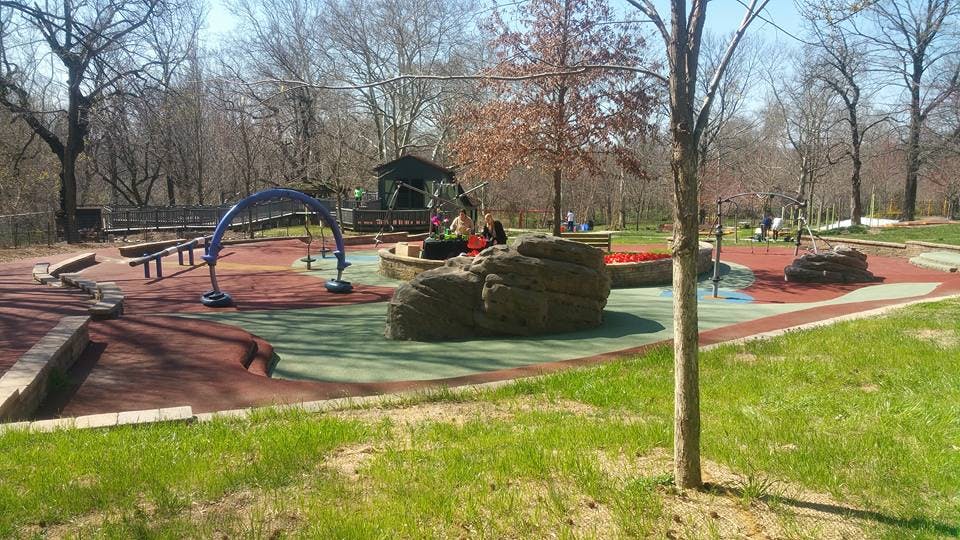 Playground with various play structures and soft ground