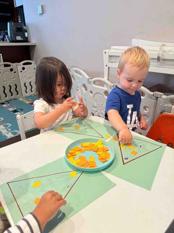 Children doing an art activity at a table