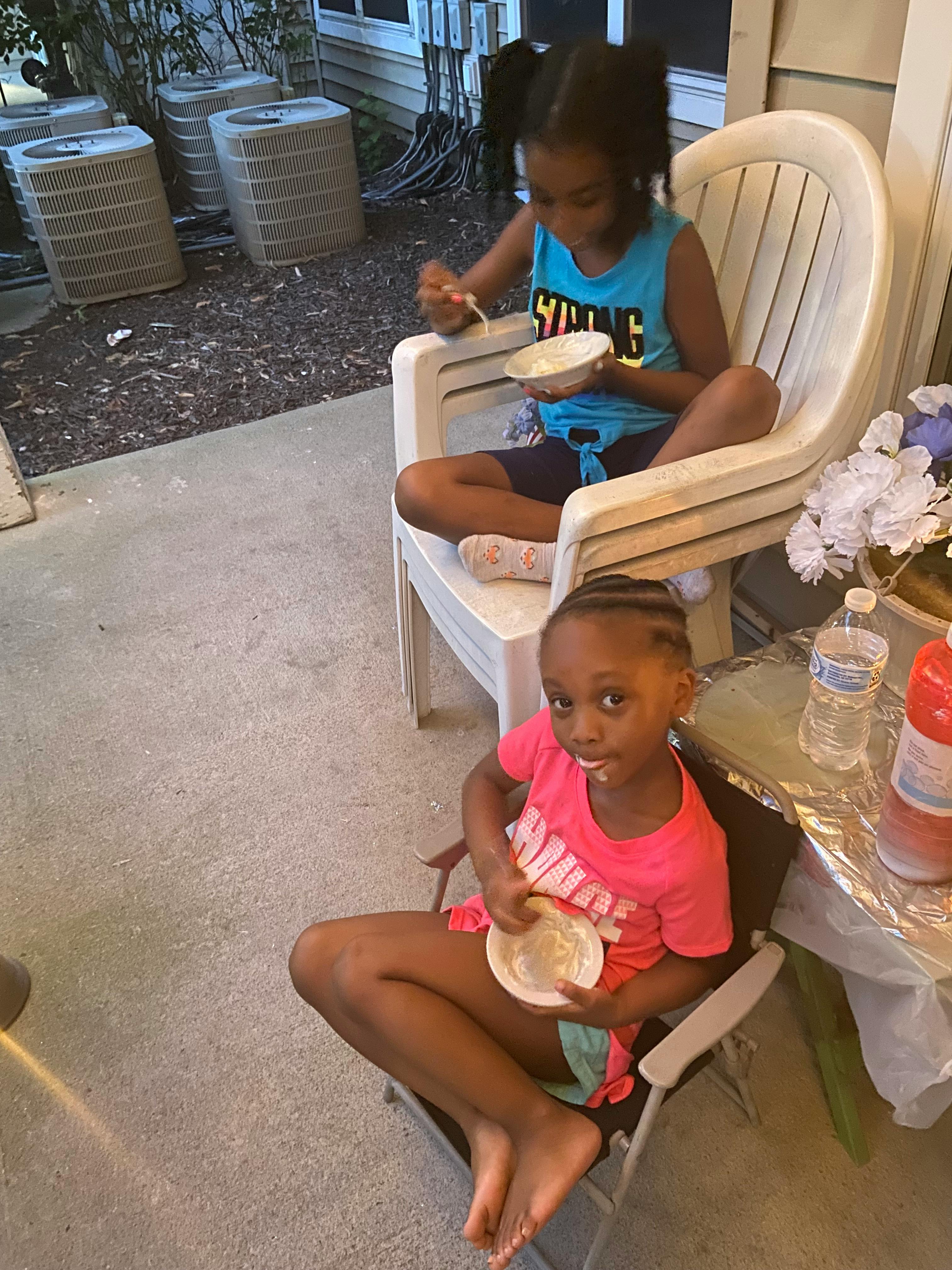 Two children sitting in chairs eating from different angles, eating from above
