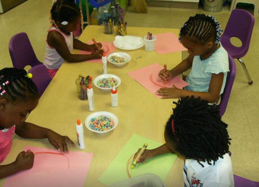 Children doing crafts at a table